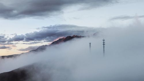 Smoke emitting from volcanic mountain against sky