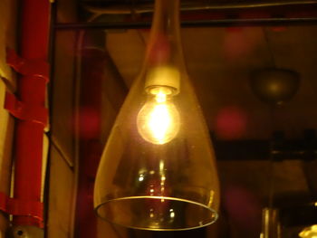 Close-up of light bulb at night