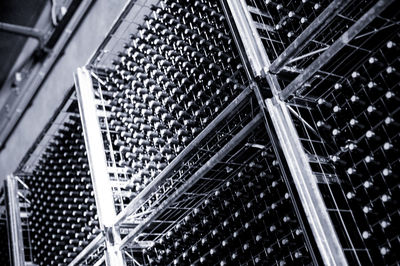 High angle view of bottles in tray at factory