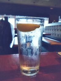 Close-up of beer glass on table