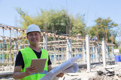 Portrait of man working on construction site