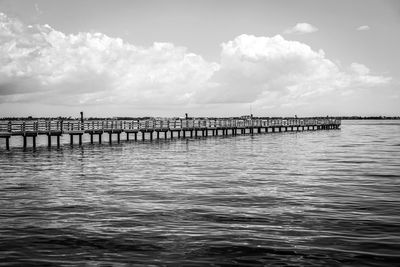 Pier over sea against sky