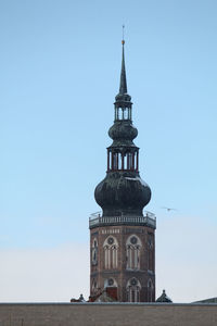 Greifswald's cathedral - tower top of building against blue sky
