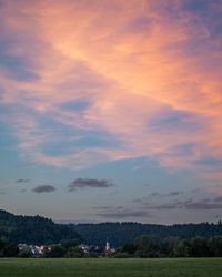 Scenic view of landscape against sky during sunset