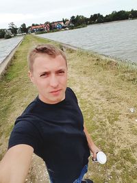 Portrait of young man in grass