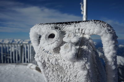 Close-up binocular at viewpoint covered with snow