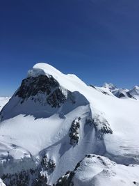 Idyllic shot of snowcapped matterhorn against clear sky