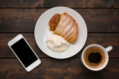 Coffee break with coffee, apple pie, and cell phone