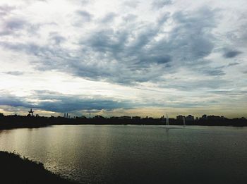 Scenic view of sea against cloudy sky