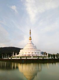 View of temple building against cloudy sky