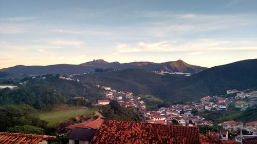 High angle view of town against cloudy sky