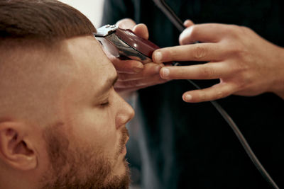 Close-up of man using mobile phone