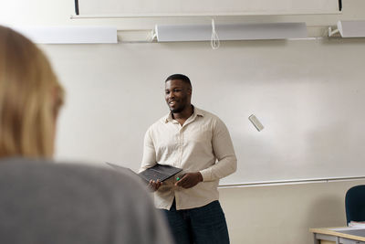 Teacher giving lecture in classroom