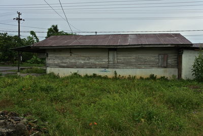 House on field against sky