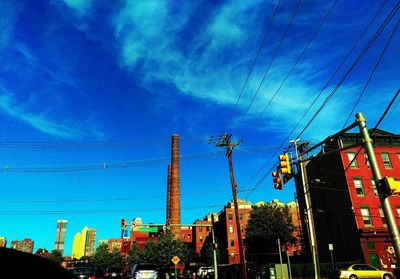 Low angle view of buildings against blue sky