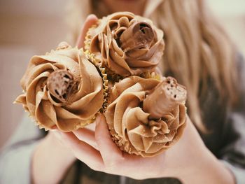 Close-up of hand holding flower