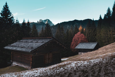 Scenic view of snow covered landscape and mountains against sky