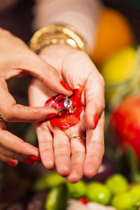 Close-up of hand holding strawberry