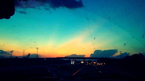 Road against cloudy sky at dusk