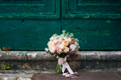 Close-up of woman with rose bouquet