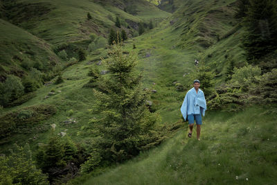 High angle view of man walking on landscape