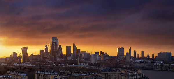 Cityscape against sky during sunset