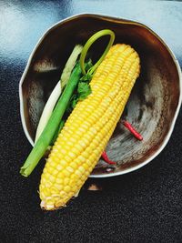 Close-up of corn in plate on table