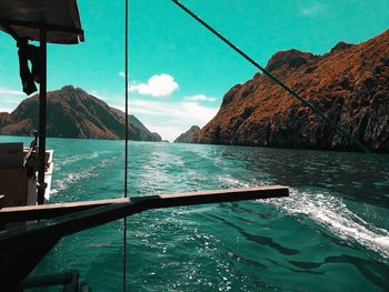 Low section of boat in sea against sky