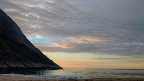 Scenic view of sea against sky at sunset