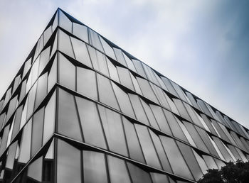 Low angle view of office building against sky