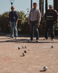 Full length of men playing with ball