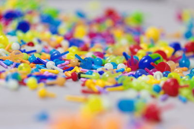 High angle view of multi colored candies on table