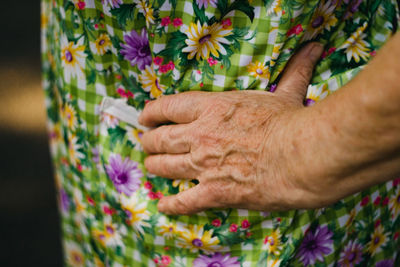 Close-up of hand on flowering plants