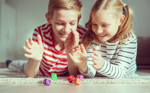 Cheerful kids playing at home