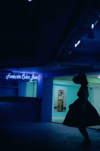 Woman in illuminated room