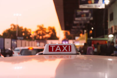 Close-up of taxi sign on car
