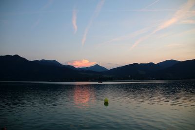 Scenic view of lake against sky during sunset