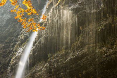 Pericnik waterfall in autumn at triglav national park in slovenia with fall colors