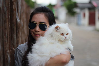 Portrait of young woman with sunglasses