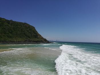 Scenic view of sea against clear blue sky