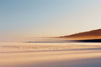 Scenic view of beach against clear sky