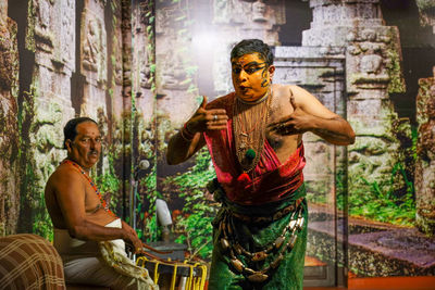 Statue of man sitting in temple