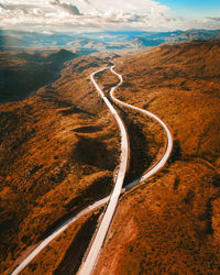 High angle view of road on land against sky