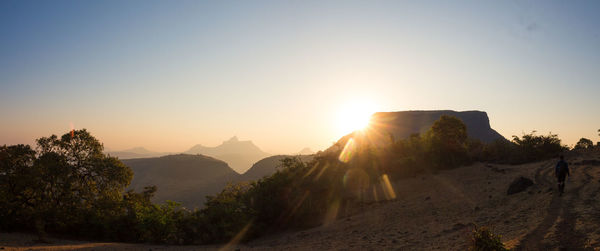 Scenic view of mountains against sky during sunset