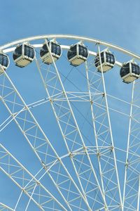 Low angle view of ferris wheel against sky