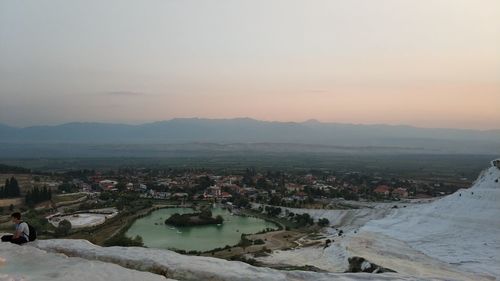 High angle view of buildings against sky during sunset