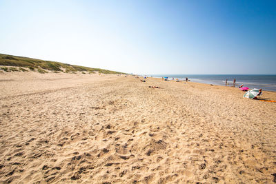 Scenic view of beach against clear sky