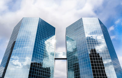 Low angle view of modern buildings against sky