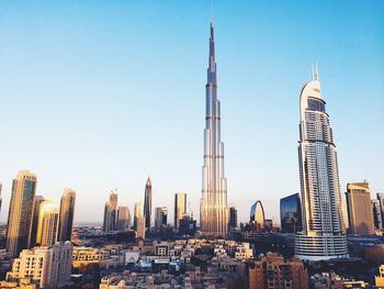 Low angle view of buildings against blue sky