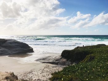 Scenic view of sea against cloudy sky